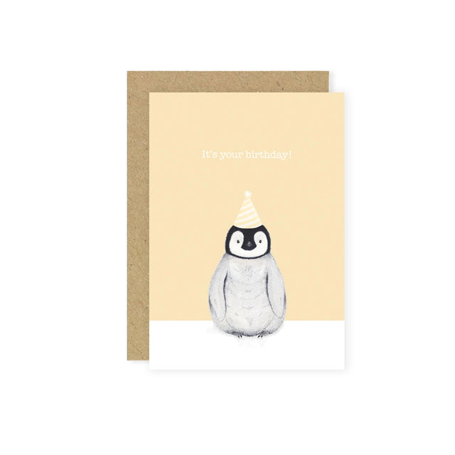 Greeting card with a penguin wearing a party hat on a beige background