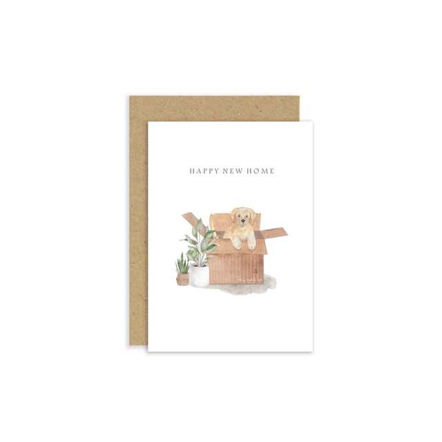 Greeting card with a dog illustration and 'Happy New Home' text, featuring a kraft envelope.
