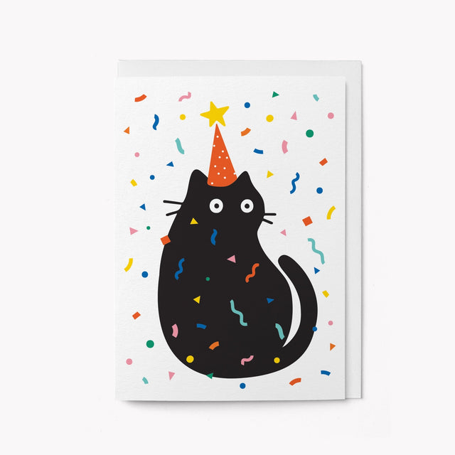 Illustration of a black cat wearing a party hat with colorful confetti on a white background