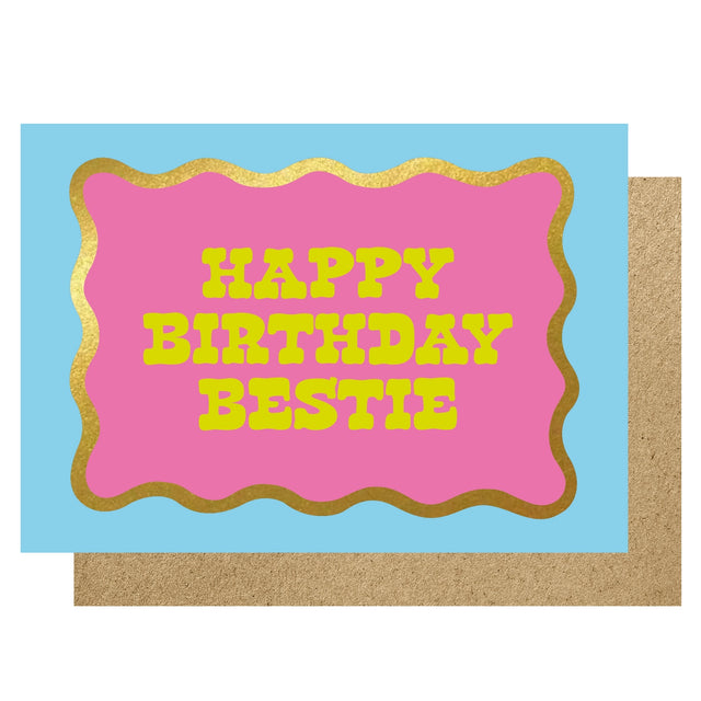 Birthday card with 'Happy Birthday Bestie' text on a pink and gold border against a blue background.