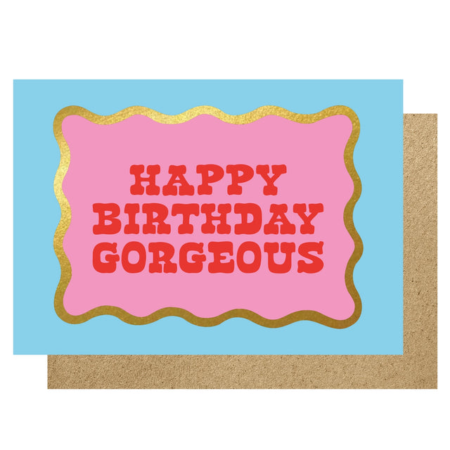 Birthday card with 'Happy Birthday Gorgeous' text on a pink and gold border against a blue background.