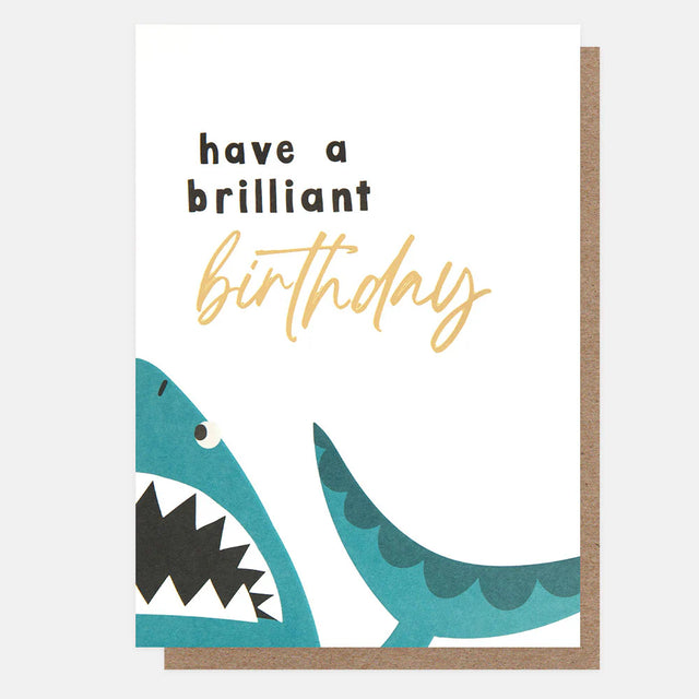 Birthday card with a shark illustration and text 'have a brilliant birthday' on a white background.