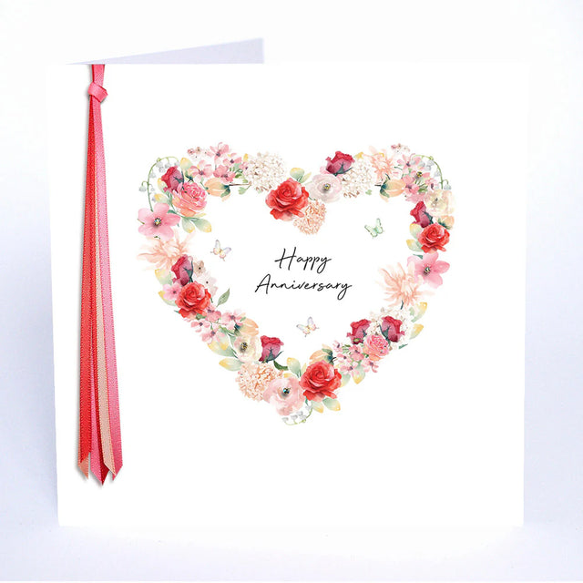 Floral heart design with 'Happy Anniversary' text on a white background