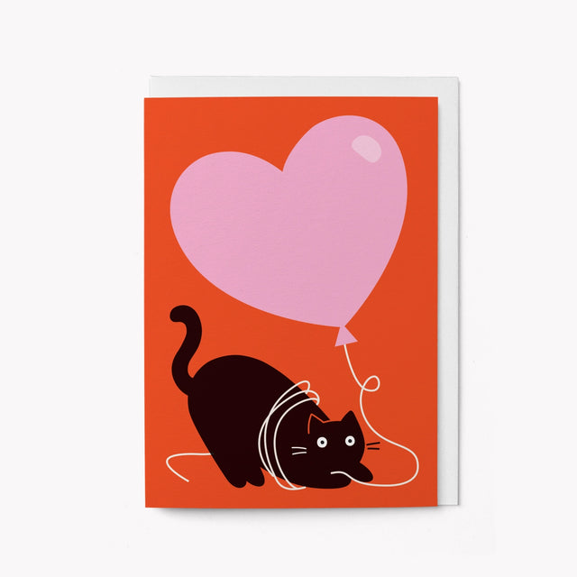 cat-with-pink-heart-balloon-greeting-card-graphic-factory