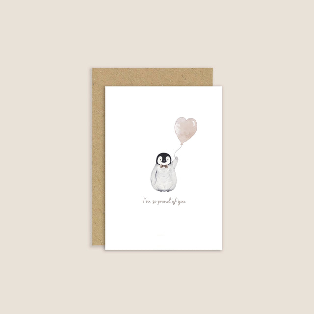 Greeting card with a penguin holding a heart-shaped balloon on a beige background