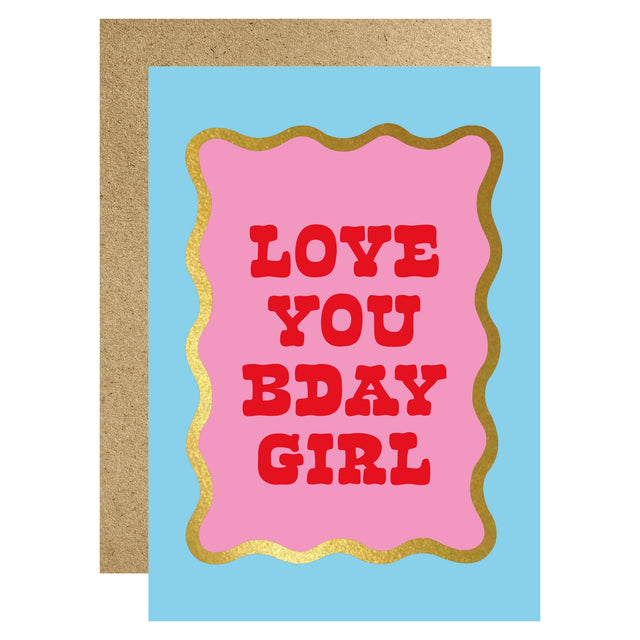 Greeting card with 'Love You Bday Girl' text on a pink background with gold border, on a blue card with brown envelope.